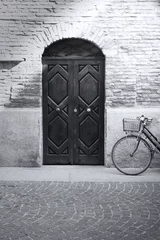 Poster Im Rahmen Black and white antique facade and bicycle © vali_111