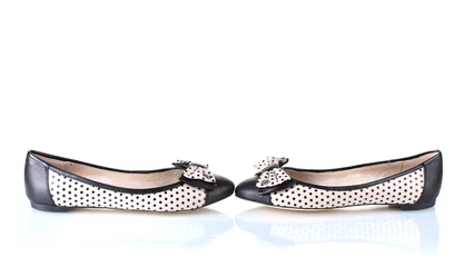 Tuinposter Female flat ballet shoes patterned with black polka dots © Africa Studio