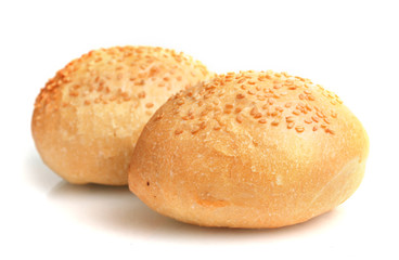 delicious buns with sesame seeds isolated on white