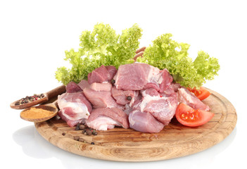 Pieces of raw meat and vegetables