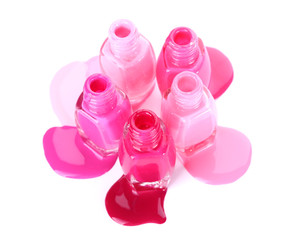 open bottles with bright nail polish isolated on white