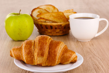 Classical breakfast. Coffee and croissant