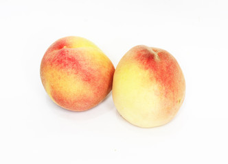 two peaches on white background
