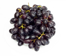 Bunch of black grapes isolated on white background