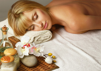 Obraz na płótnie Canvas A young woman is lying during a spa treatment