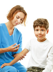 A female doctor is making an injection to the boy