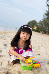 Little girl playing sand
