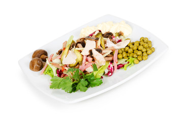 meat salad with ham and neat's tongue isolated on white backgrou