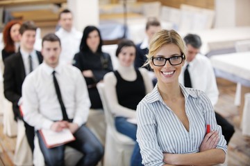 business woman standing with her staff at conference