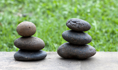 Brown flat stones in blance in the garden on the floor