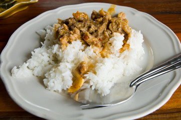 Delicious fried rice and meat close-up on white
