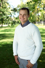 Young man in summer park