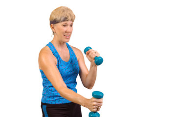 Attractive baby-boomer exercising with weights