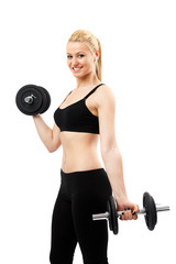 Obraz premium Athletic young lady working out with weights