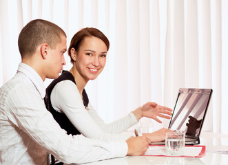 Colleagues working together in office.