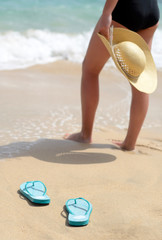 Woman on the beach in vertical view