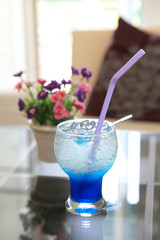 blue cocktail martini with flower