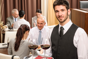 Waiter hold wine glasses business lunch restaurant
