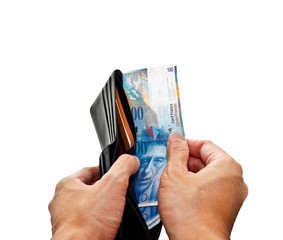 hand opening wallet with Swiss Franc banknotes