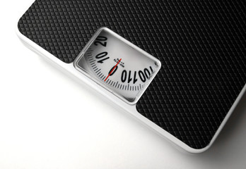 Dieting concept with scales on the white background - 40551496