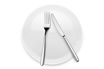 table set with fork and knife over plate, on white background