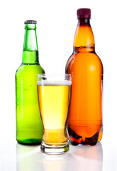 Isolated Glass Beer in plastic bottle and glass green bottles wi