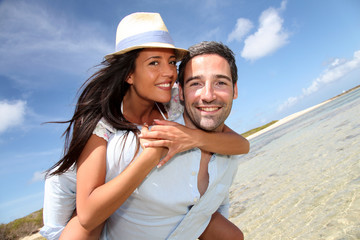 Lovers enjoying sunny day at the beach.