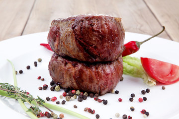 beef fillet pieces on wood