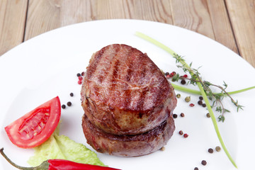 beef fillet pieces on wood