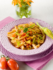 pasta with zucchinis flower and fresh tomatoes,healthy food