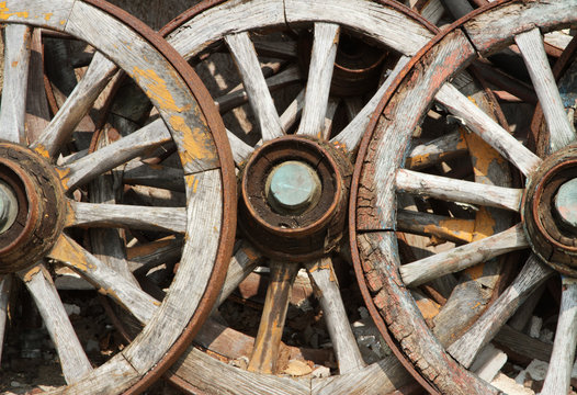 Trio of old wagon cart wheels