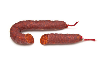 Chorizo De Pueblo sausage isolated on a white studio background.