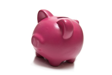 Piggy bank or money box isolated on a white studio background.