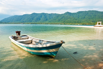 Naklejka na ściany i meble Fishing boat in the Tropical sea