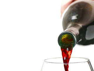 red wine being poured into glas