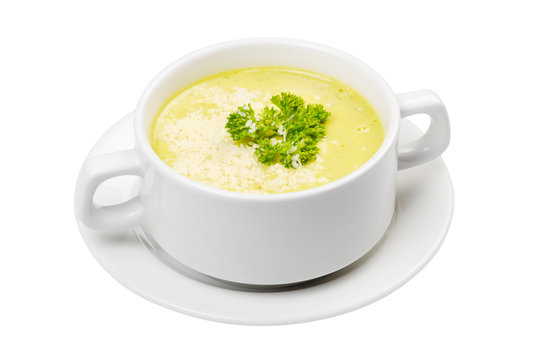 cream soup in white bowl isolated