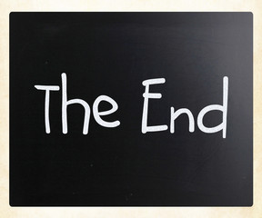 "The End" handwritten with white chalk on a blackboard