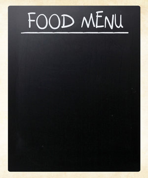 "Food menu" handwritten with white chalk on a blackboard