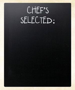 "Chef's Selected" handwritten with white chalk on a blackboard