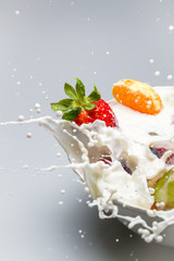 Breakfast splash with milk and fresh fruits