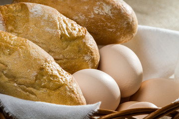 Closeup eggs and easter bread in wicker basket