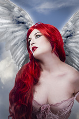 Beautiful sexy angel with wings, red long hair woman