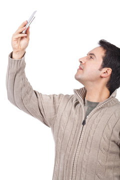 man taking pictures with his cellphone
