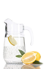 pitcher of lemonade and lemon isolated on white