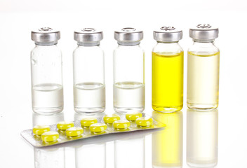 Tablets and ampoules isolated on white