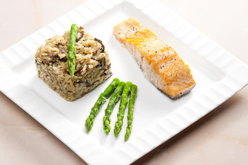 baked salmon with mushroom risotto and green asparagus