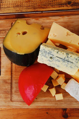 delicious cheeses on wood