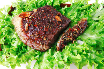 red beef meat on green salad