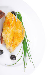 served fish fillet with greek olives