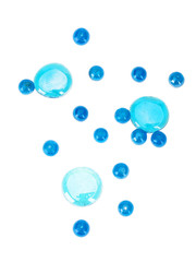 Blue round  beads and pebbles isolated on white